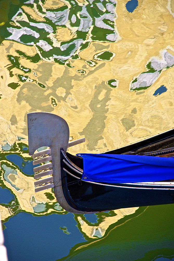 Gondola among reflections on a canal, Venice, UNESCO World Heritage Site, Veneto, Italy, Europe