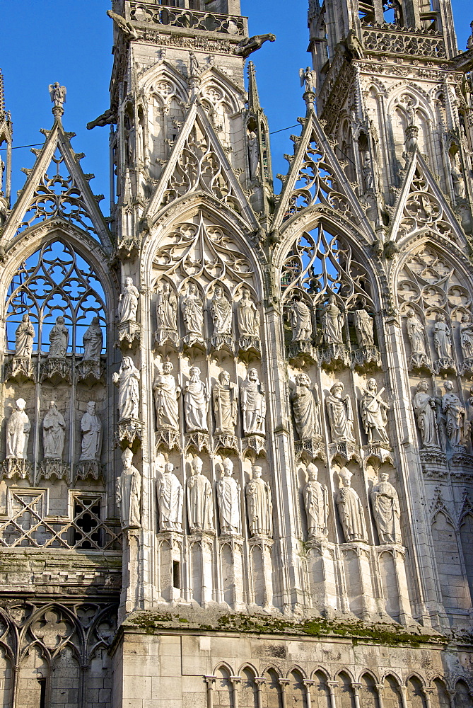 Stone statues of prophets, apostles, and archbishops, central doorway, western facade, on exterior of Cathedral Notre Dame dating from the 12th century, Rouen, Upper Normandy, France, Europe