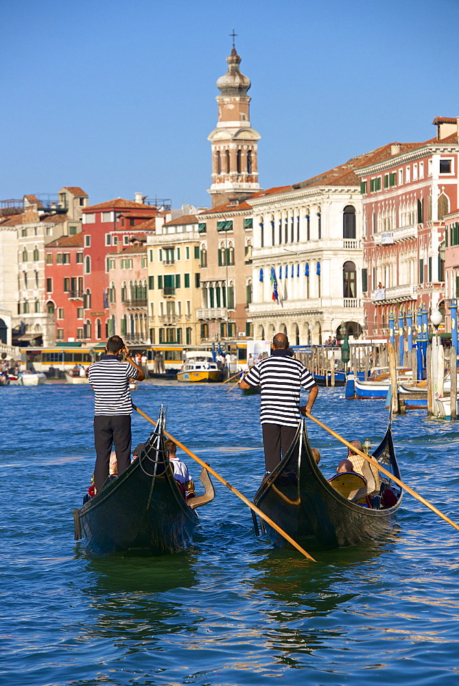 Gondolas and gondoliers, palaces facades and church steeple, Grand Canal, Venice, UNESCO World Heritage Site, Veneto, Italy, Europe