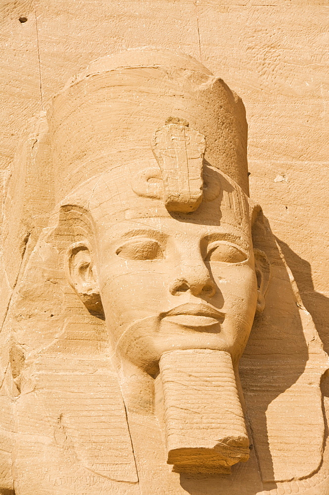 Close up of the head of a giant statue of the great pharaoh Rameses II outside the relocated Temple Rameses II at Abu Simbel, UNESCO World Heritage Site, Egypt, North Africa, Africa