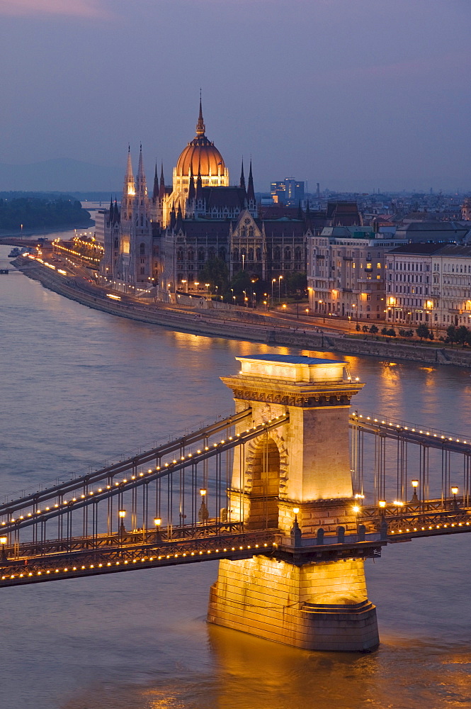 Panorama of city at dusk with the Hungarian Parliament building, and the Chain bridge ( Szechenyi Lanchid), over the River Danube, UNESCO World Heritage Site, Budapest, Hungary, Europe