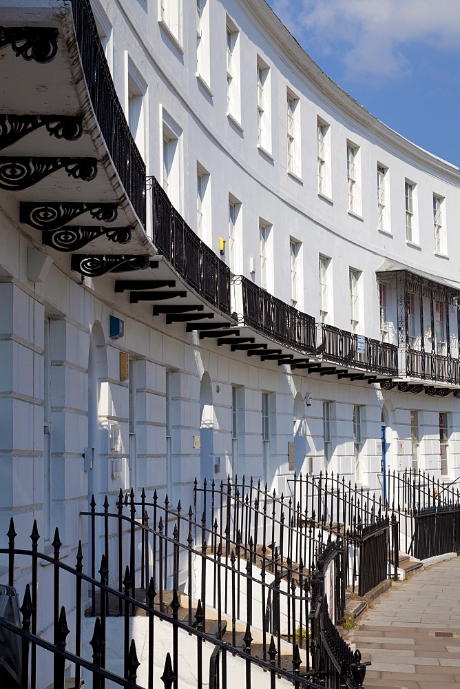 Terrace of Regency style Georgian houses with wrought iron balconies on The Royal Crescent, Cheltenham Spa, Gloucestershire, England, United Kingdom, Europe