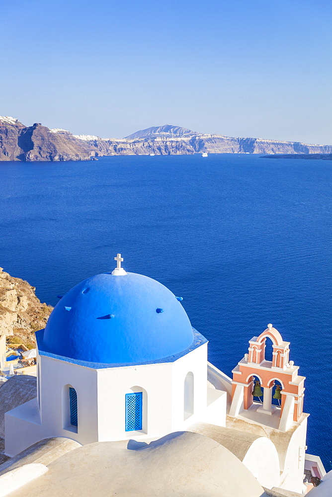 Greek church with blue dome and pink bell tower, Oia, Santorini (Thira), Cyclades Islands, Greek Islands, Greece, Europe