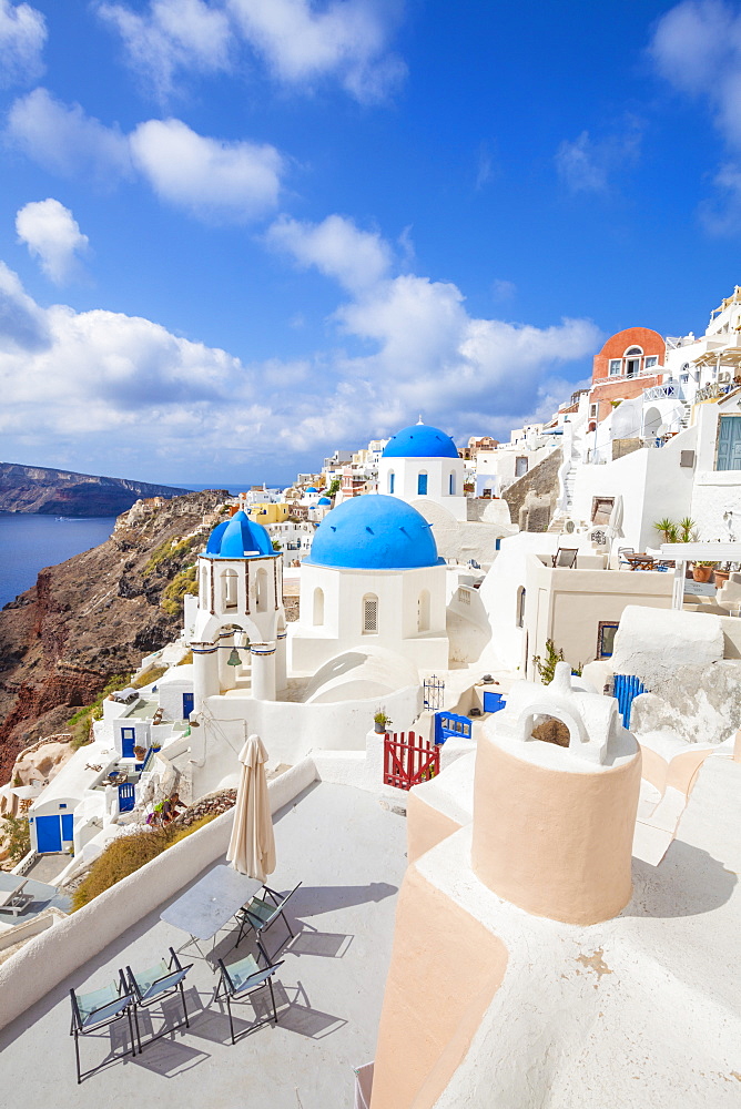 Greek church with three blue domes in the village of Oia, Santorini (Thira), Cyclades Islands, Greek Islands, Greece, Europe