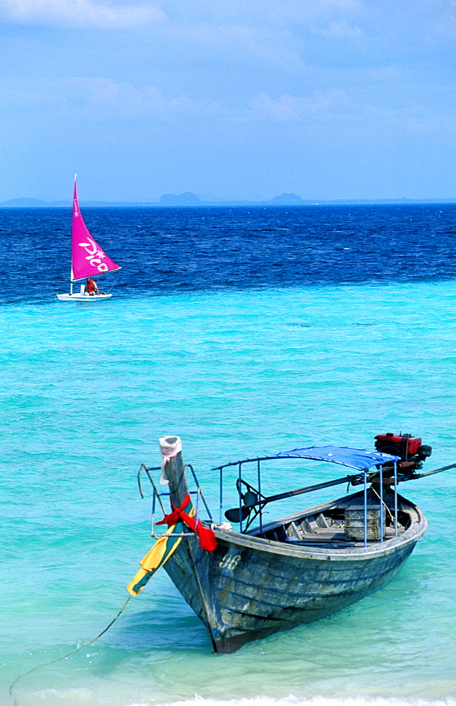 Thailand, Phuket Island, (Near) , Koh Phi Phi Islands, Windsurf And Long Tail Outrigger On A Beach