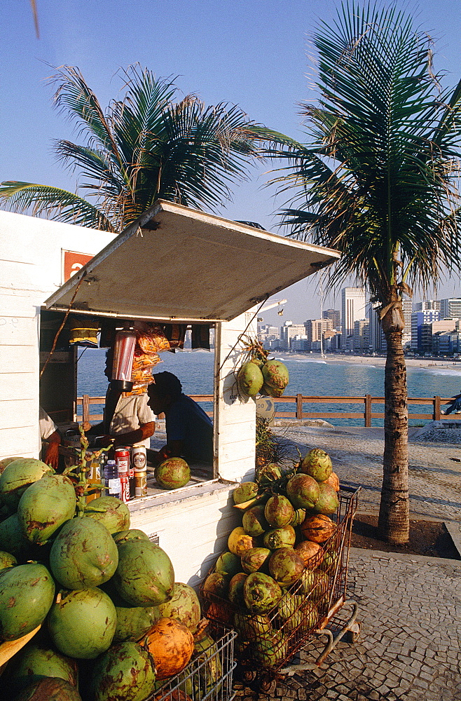 Brazil, Rio De Janeiro, Copacabana, Kiosk On The Beach Selling Coconuts