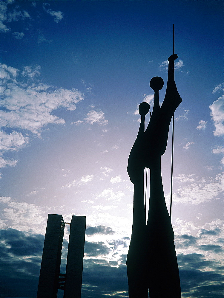 Brazil, Goias, Brasilia, The Administrative Capital Created Par President Kubitschek And Designed By Brasilian Town Planner Lucio Costa & Architect Oscar Niemeyer, Bruno Giorgi Sculpture Gueireros Dedicated To Brasilia Workers In Counterlight