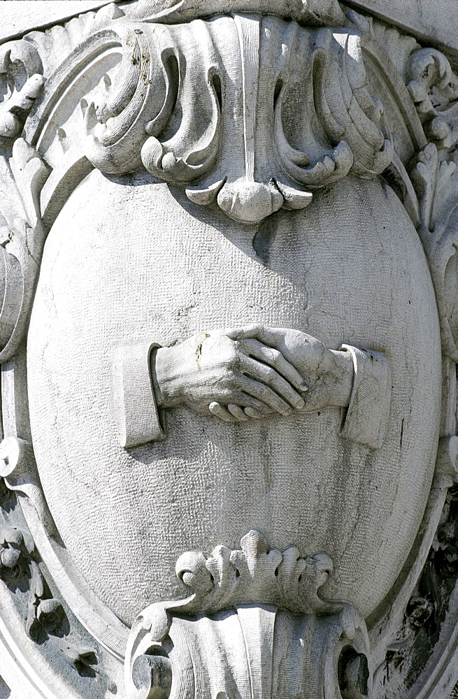 Portugal, Lisbon, Shaking Hands Carved At A Streets Corner