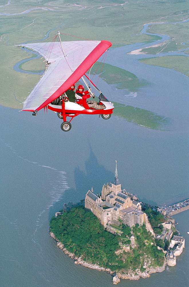 Aerial view of microlight and Mont Saint Michel (Mont-St. Michel), UNESCO World Heritage Site, Normandy, France, Europe