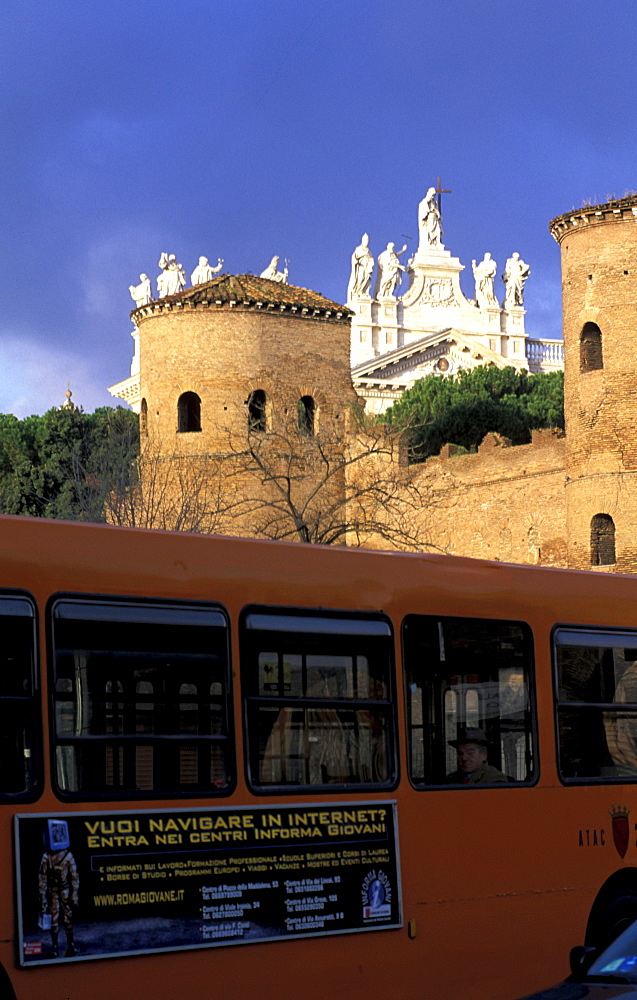 Italy, Rome, Bus At The Ramparts, Behind Is San Giovanni De Latrano Basilica