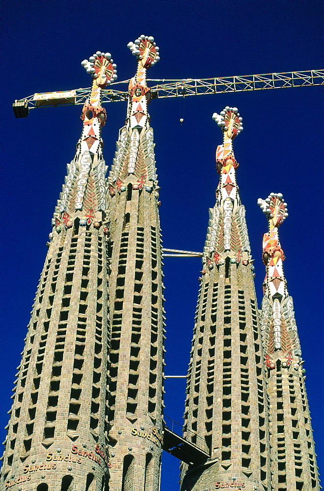 Spain, Catalonia, Barcelona, Sagrada Familia Church Under Construction Designed By Gaudi, The Four Belfries And Crane