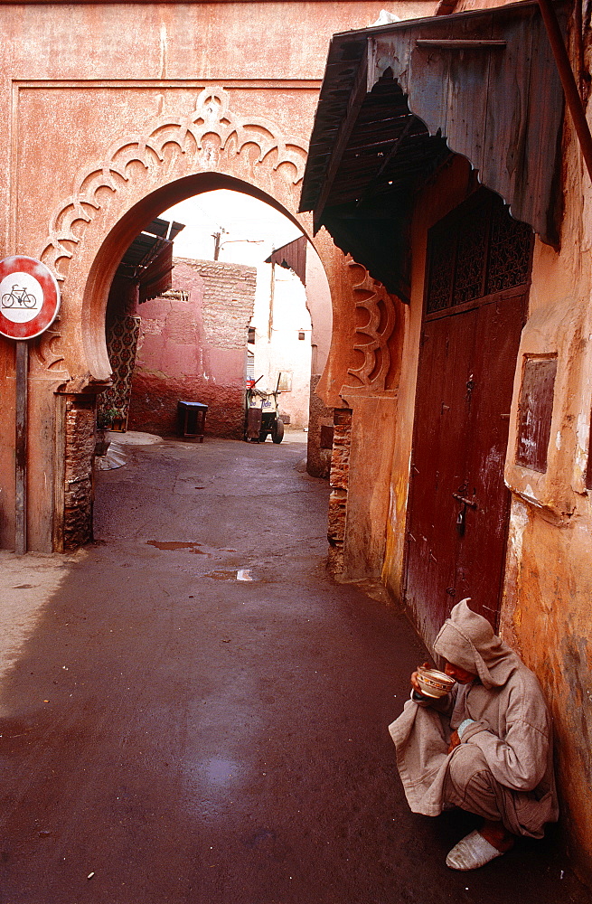 Morocco, Marrakech, Medina, Early Morning, Man Drinking Tea Outside His House