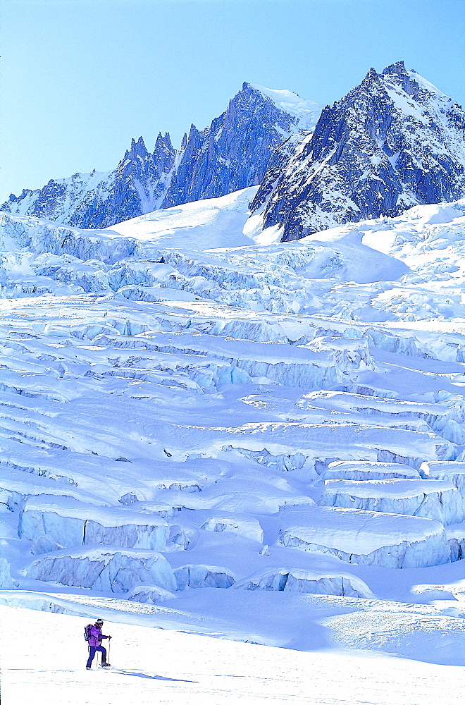 France, Alps In Winter, Haute Savoie, Chamonix, Lonesome Skier In Vallee Blanche Trail, Glacier Seracs Behind 