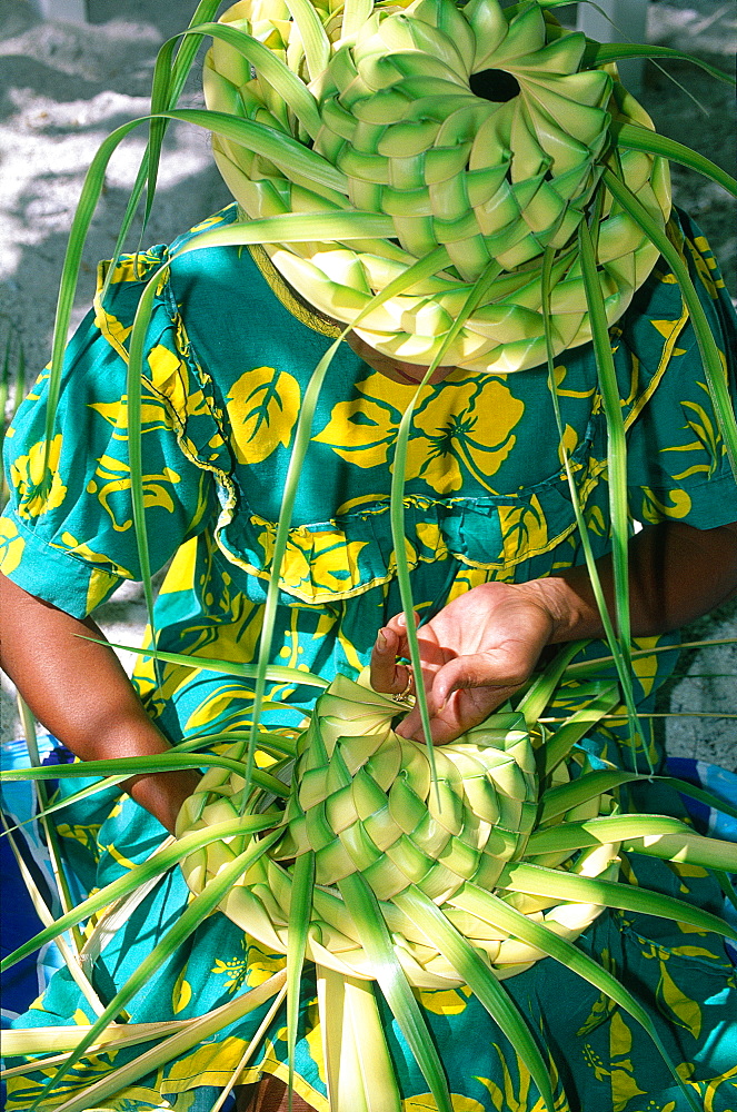 French Polynesia, The Leeward Islands (Iles Sous-Le-Vent), Bora-Bora Island, Woman Making Hats With Raw Coconut Palm