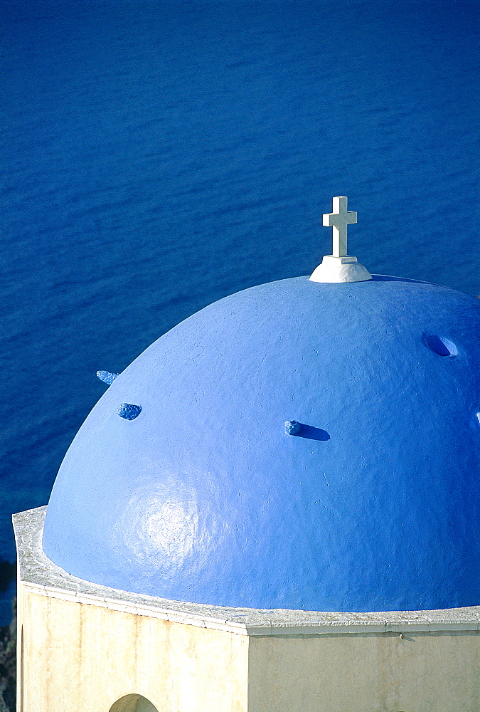 Greece, Cyclades, Santorini Island, Blue Dome On A Chapel With Small White Cross Against Blue Sea