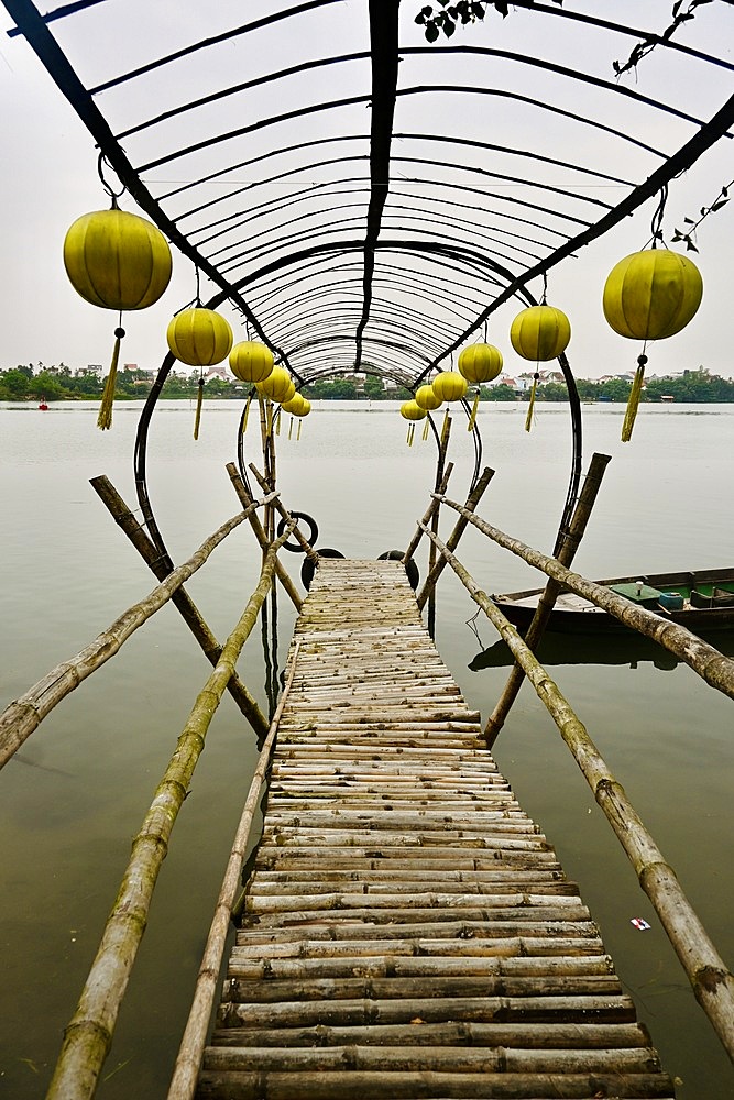 Wooden jetty on Thu Ban River, Vietnam