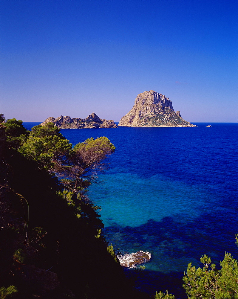 View of the rocky islet of Es Vedra from Cala d'Hort, near Sant Antoni, Ibiza, Balearic Islands, Spain, Mediterranean, Europe