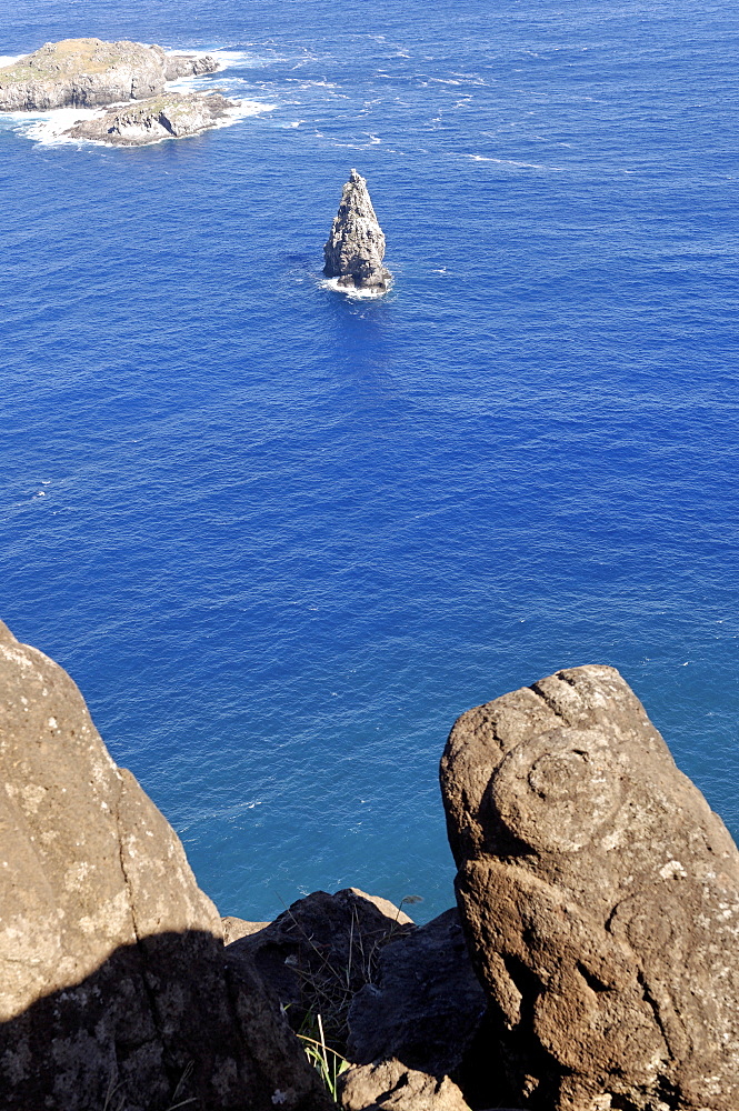 Petroglyphs beside the lake in a crater at Orongo, Easter Island, Chile, South America