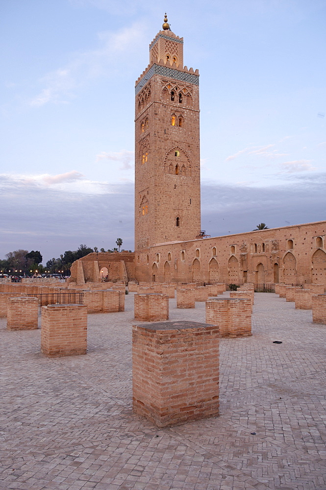 The Koutoubia minaret rises up from the heart of the old medina next to a mosque of the same name, Marrakesh. Morocco, North Africa, Africa