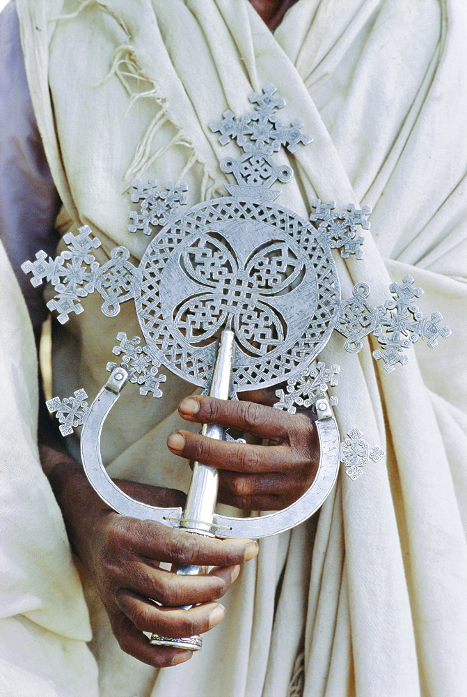 Close up of priest holding cross, Church of Narga Selassie, Lake Tana, Gondar, Ethiopia, Africa 