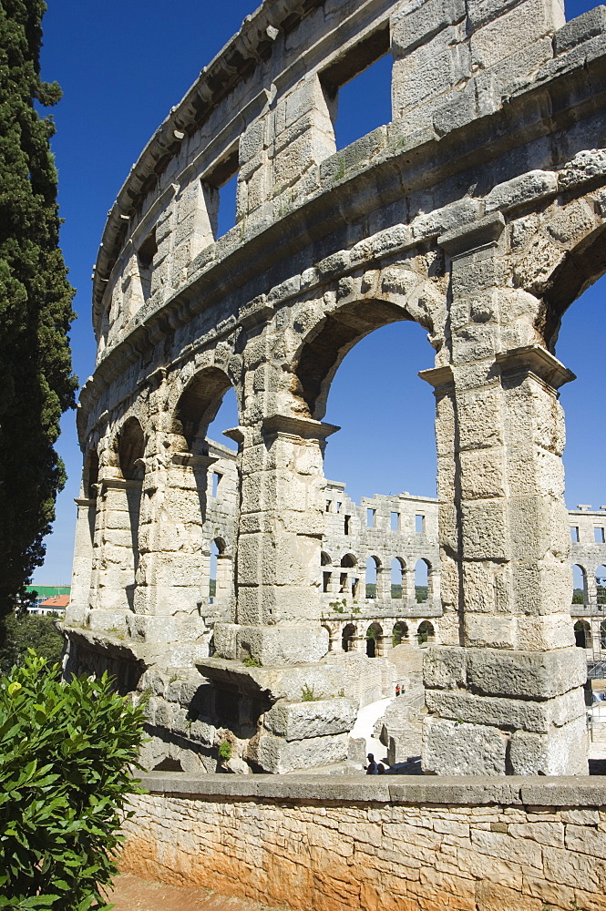 The 1st century Roman amphitheatre, columns and arched walls, Pula, Istria, Croatia, Europe