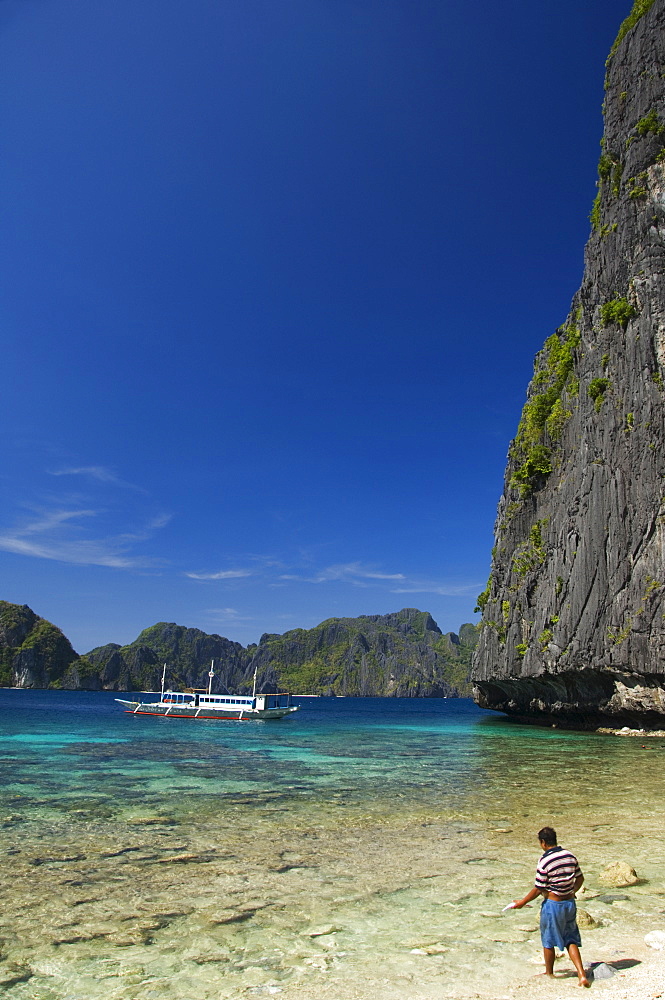 Fisherman on Coral Fringe Clear Waters, Bacuit Bay, El Nido Town, Palawan Province, Philippines, Southeast Asia, Asia