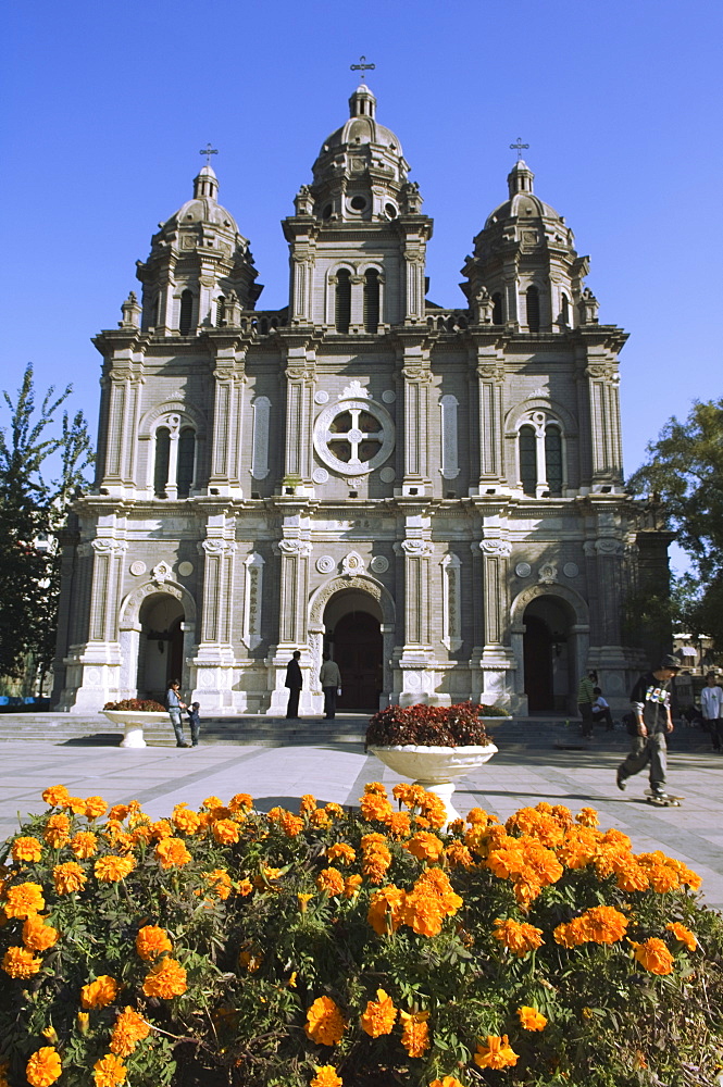 Flowers in front of St. Josephs Church (the East Church) built in 1655 during the reign of Shunzhi, Wangfujing Shopping Street, Beijing, China, Asia