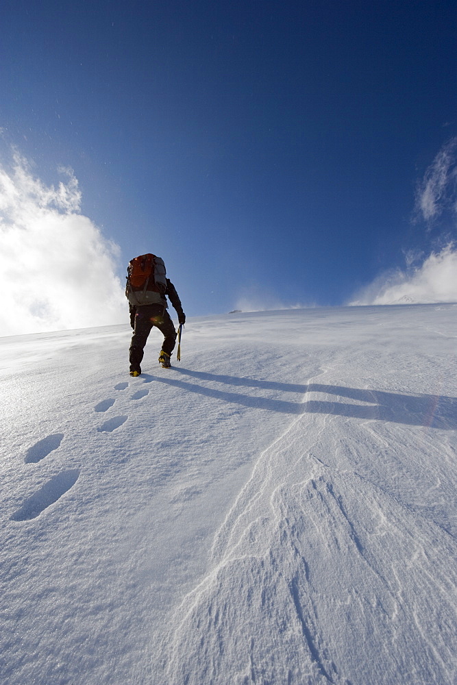 Mountain climber on snow covered Mount Fuji, Shizuoka Prefecture, Japan, Asia