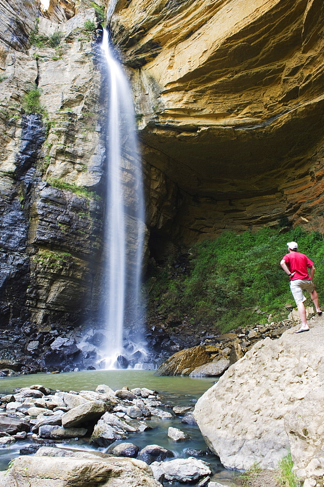 Tourist at El Hayal Waterfall, Santa Sofia, near Villa de Leyva, Colombia, South America