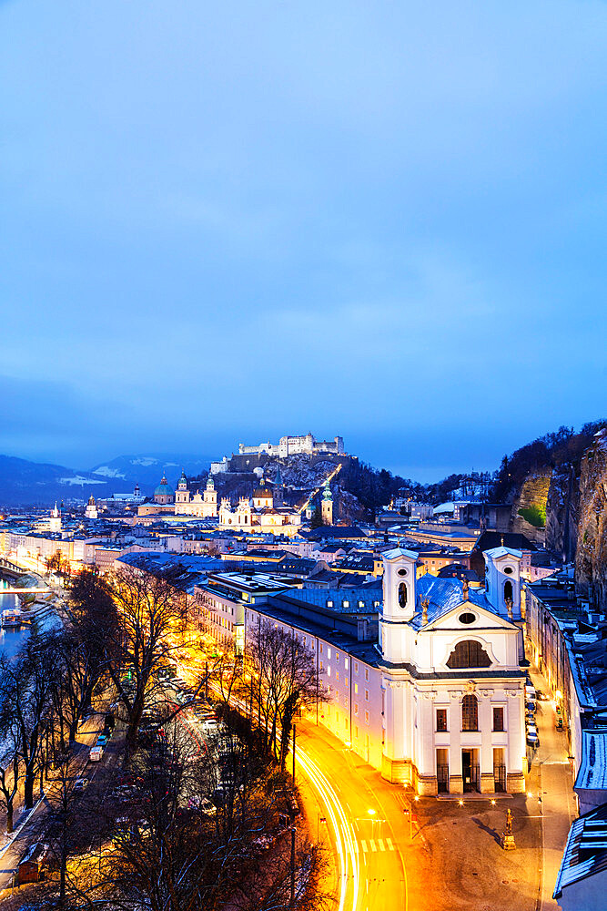 View over the old town, UNESCO World Heritage Site, Markus Church and Hohensalzburg Castle at dusk, Salzburg, Austria, Europe