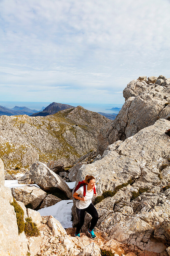 Serra de Tramuntura, hiker on Puig de Massanella Mallorca's highest accessible peak, Majorca, Balearic Islands, Spain, Mediterranean, Europe