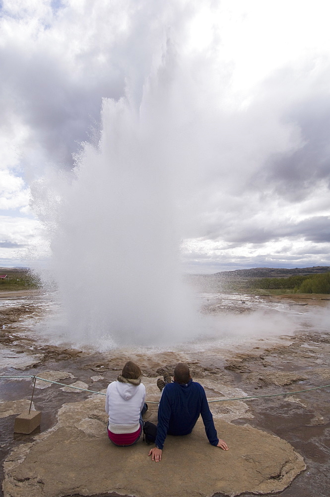 Tourists watching Strokkur Geyser erupting, Geysir, Iceland, Polar Regions