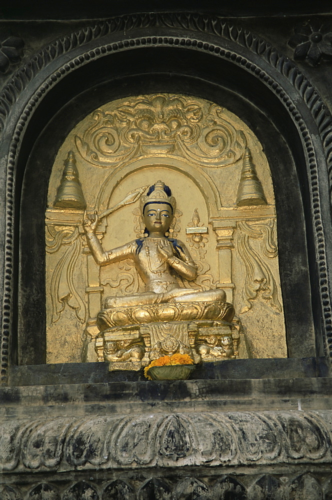 Close-up of gold relief carving of Manjushri, Bodhgaya (Bodh Gaya), Bihar state, India, Asia