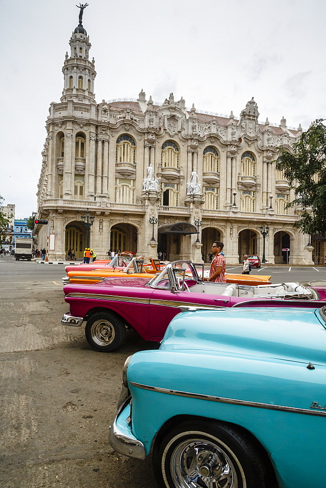 Vintage American cars parked outside the Gran Teatro (Grand Theater), Havana, Cuba, West Indies, Caribbean, Central America