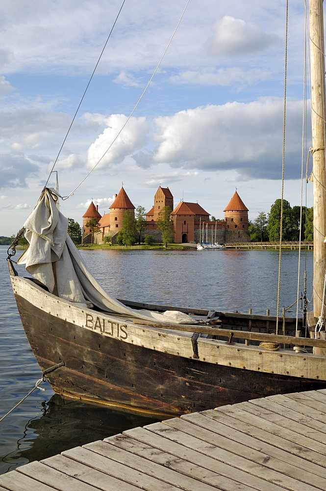 Traditional boat and Trakai Castle, Trakai, near Vilnius, Lithuania, Baltic States, Europe