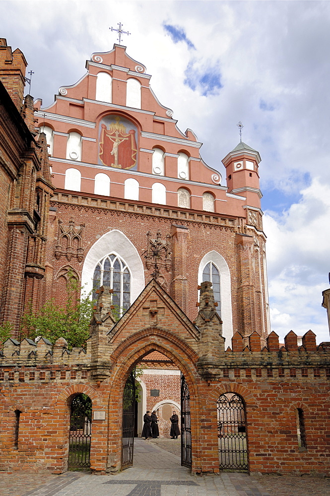 Bernardine church and monastery with monks standing by the door, Vilnius, UNESCO World Heritage Site, Lithuania, Baltic States, Europe