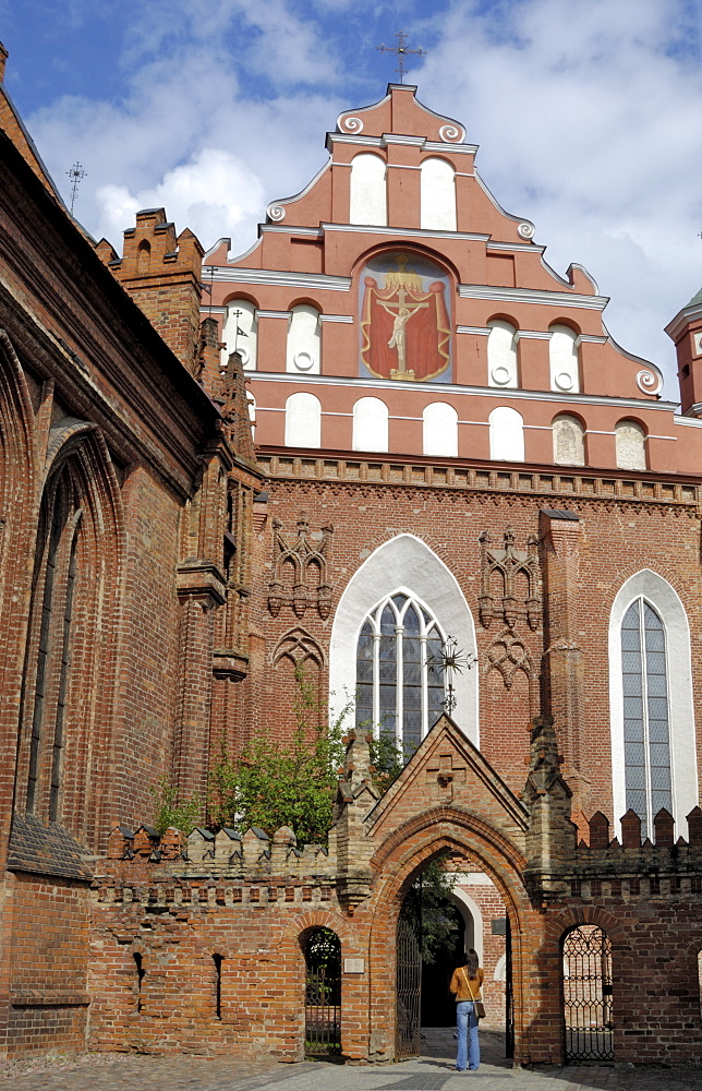 Bernardine church and monastery with a woman standing in the gateway, Vilnius, UNESCO World Heritage Site, Lithuania, Baltic States, Europe