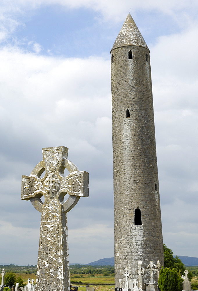 Kilmacdaugh Round Tower and Celtic style cross, near Gort, County Galway, Connacht, Republic of Ireland, Europe