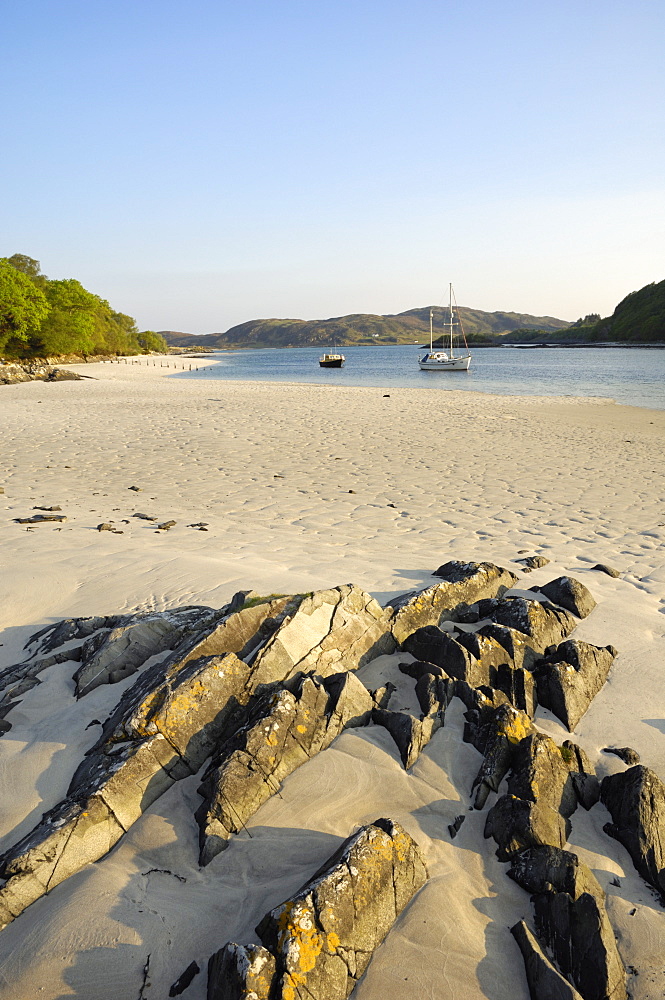 Yacht at anchor off a sandy beach at Morar, Highlands, Scotland, United Kingdom, Europe