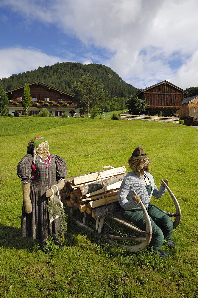 Scarecrows outside a house near Ramsau, Berchtesgaden, Bavaria, Germany, Europe