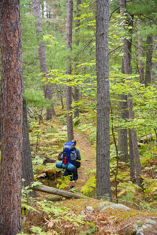 Hiker on La Cloche Silhouette Trail in Killarney Provincial Park, Ontario, Canada, North America