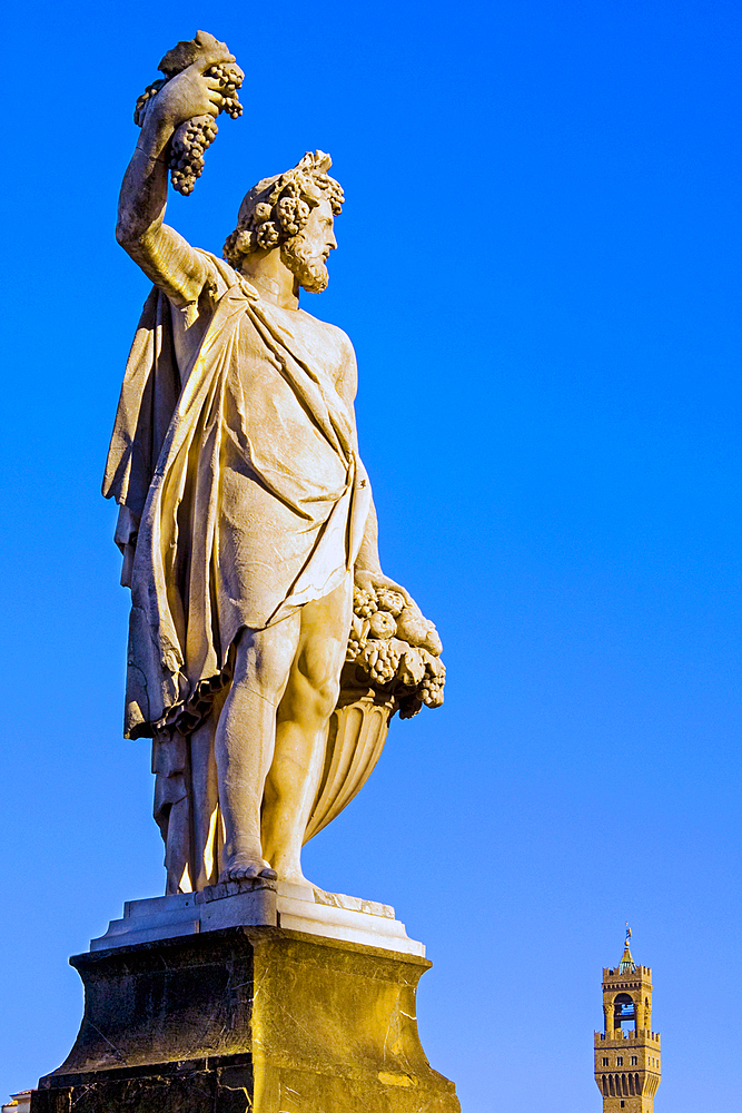 Statue of Autumn, Ponte Santa Trinita, Florence (Firenze), Tower of Palazzo Vecchio, UNESCO World Heritage Site, Tuscany, Italy, Europe