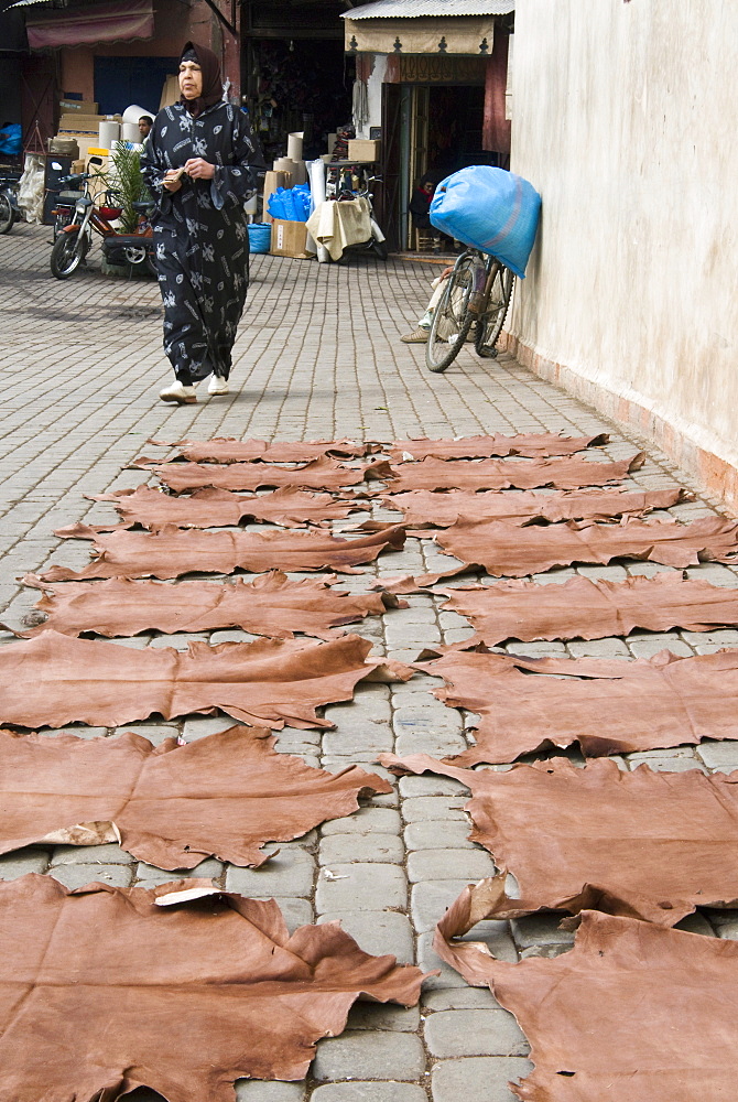 Dyed leather hides drying in street in the souk, Medina, Marrakech (Marrakesh), Morocco, North Africa, Africa