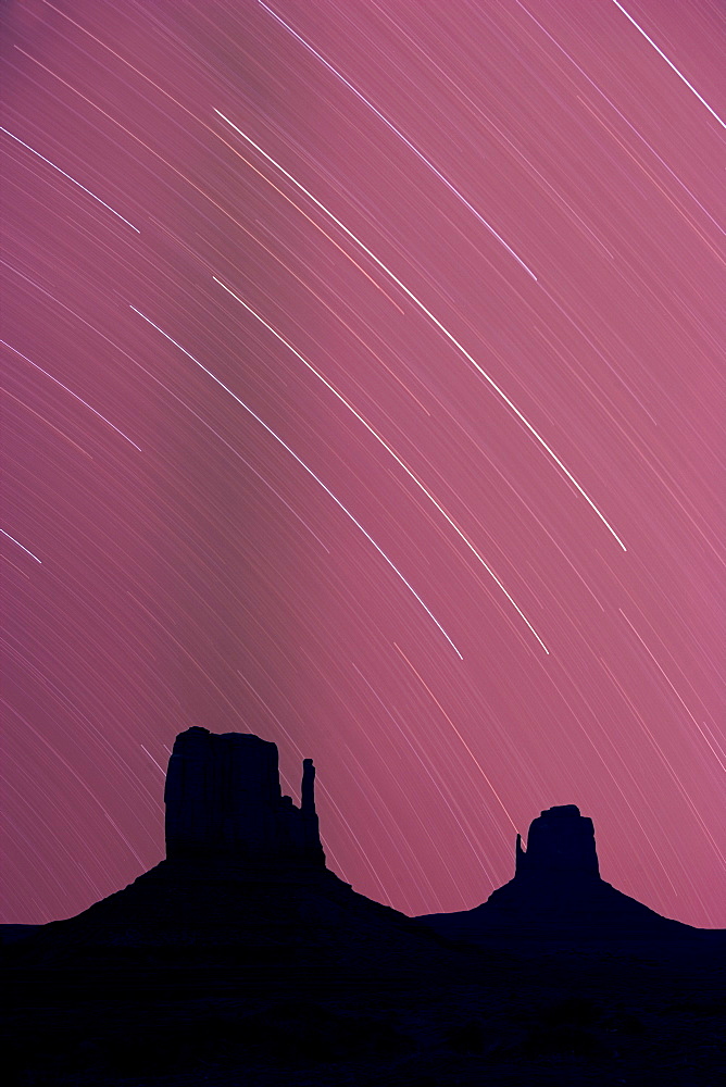 Long exposure of star trails in night sky, Monument Valley Navajo Tribal Park, Arizona Utah border, United States of America, North America