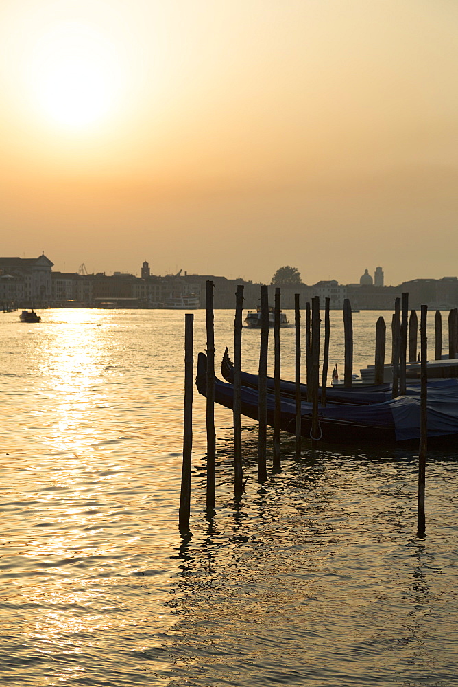 Gondolas moored at Campo della Salute on the Grand Canal at sunrise, Venice, UNESCO World Heritage Site, Veneto, Italy, Europe