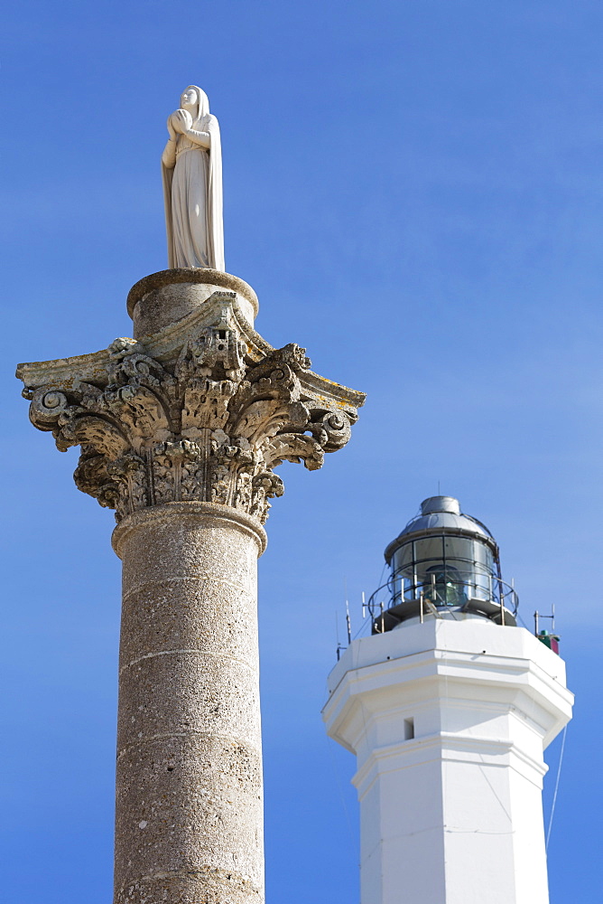 Statue and lighthouse at Santa Maria di Leuca, Leuca, Puglia, Italy, Europe