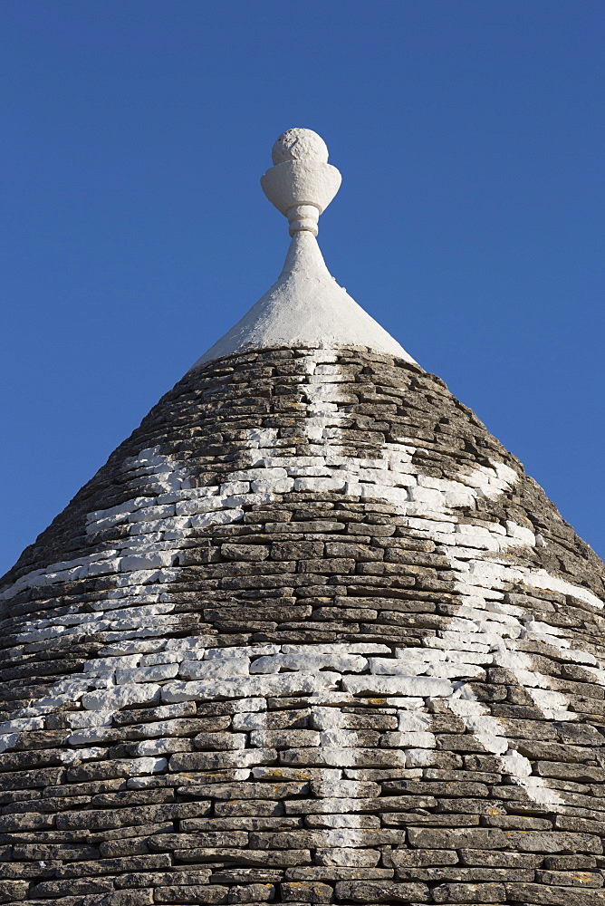 Sun painted on roof of traditional trullo in Alberobello, UNESCO World Heritage Site, Puglia, Italy, Europe