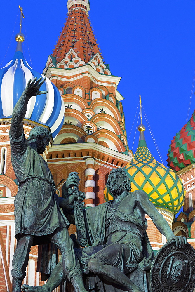 Minin and Pozharskiy statue and the St. Basil's Cathedral in Red Square illuminated in the evening, UNESCO World Heritage Site, Moscow, Russia, Europe