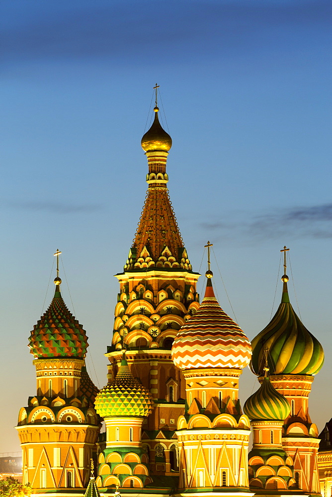 The onion domes of St. Basil's Cathedral in Red Square illuminated at night, UNESCO World Heritage Site, Moscow, Russia, Europe