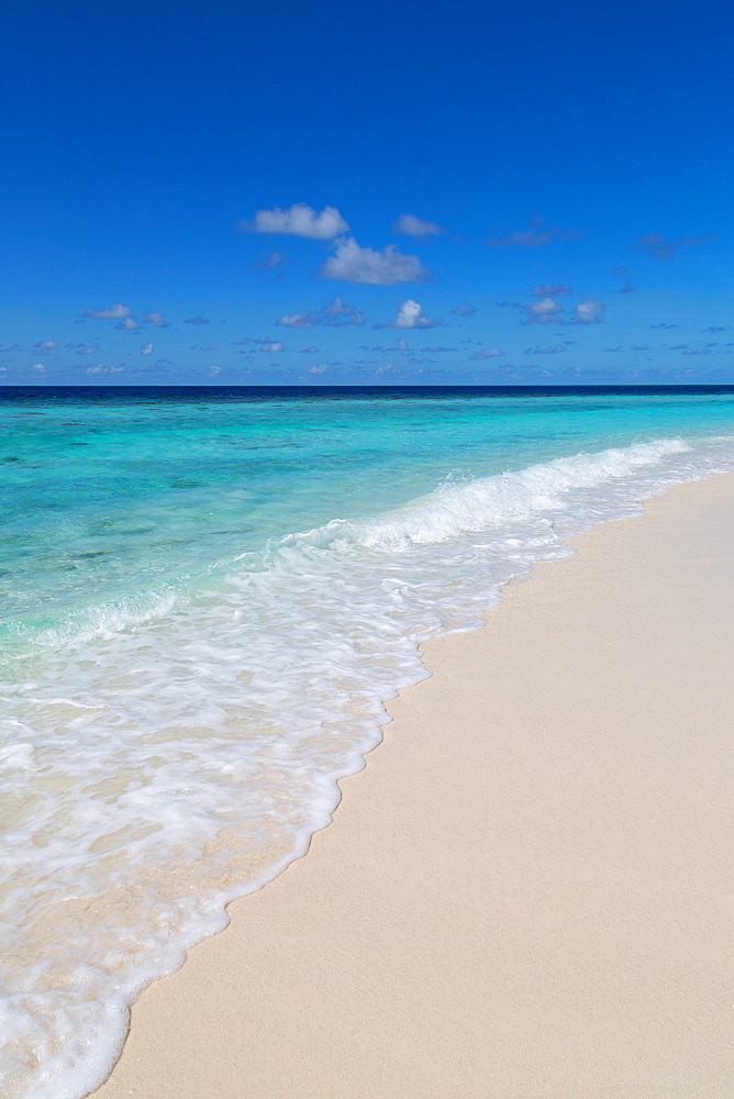 A beautiful deserted shoreline on an island in the Maldives, Indian Ocean, Asia